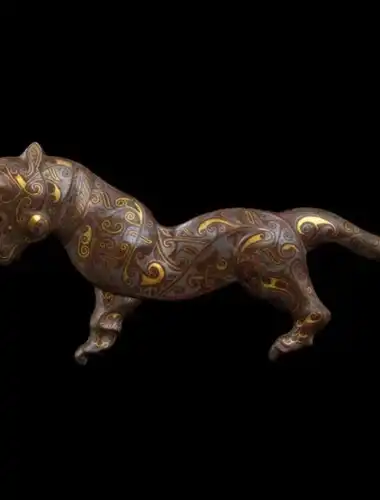Intricate historical animal sculptures and artworks from the Al Thani Collection displayed in a sophisticated gallery setting at the Hotel de la Marine.
